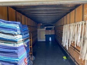 Inside view of Scotty's the movers truck with clothes and storage essentials
